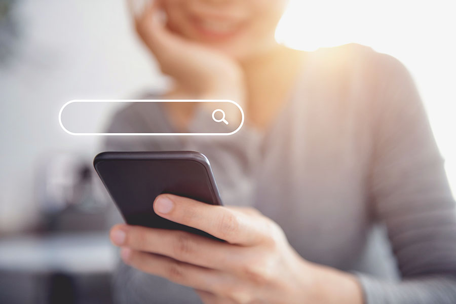 Woman using a smartphone to search for results