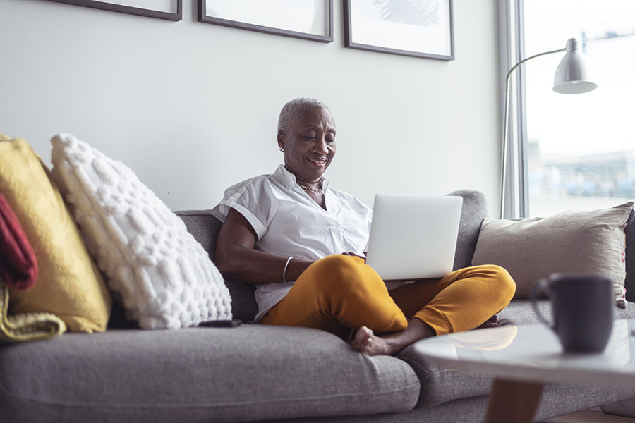 Woman searching on a laptop for the local medical expert