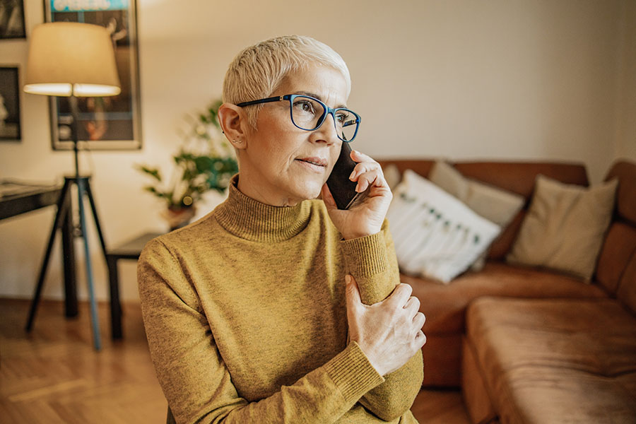 Woman on the phone scheduling an appointment