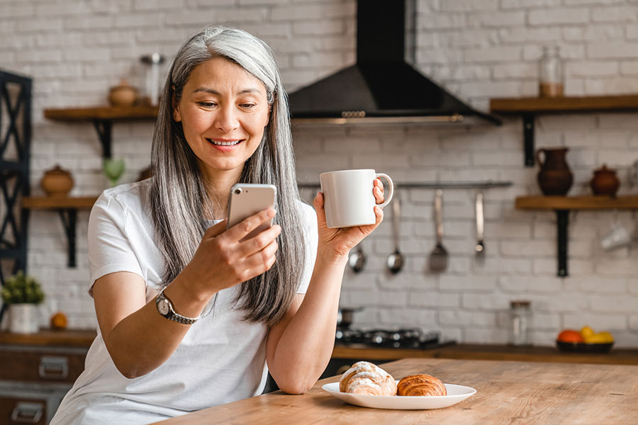 Woman using voice search on a mobile device.